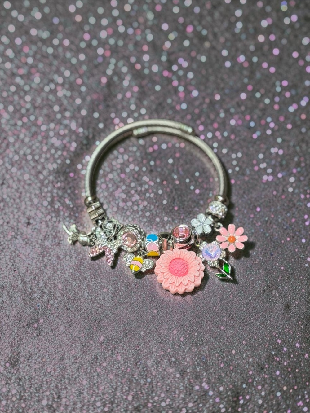 Silver Charm Adjustable Twisted Bangle with Pink Flower and Crystal Accents